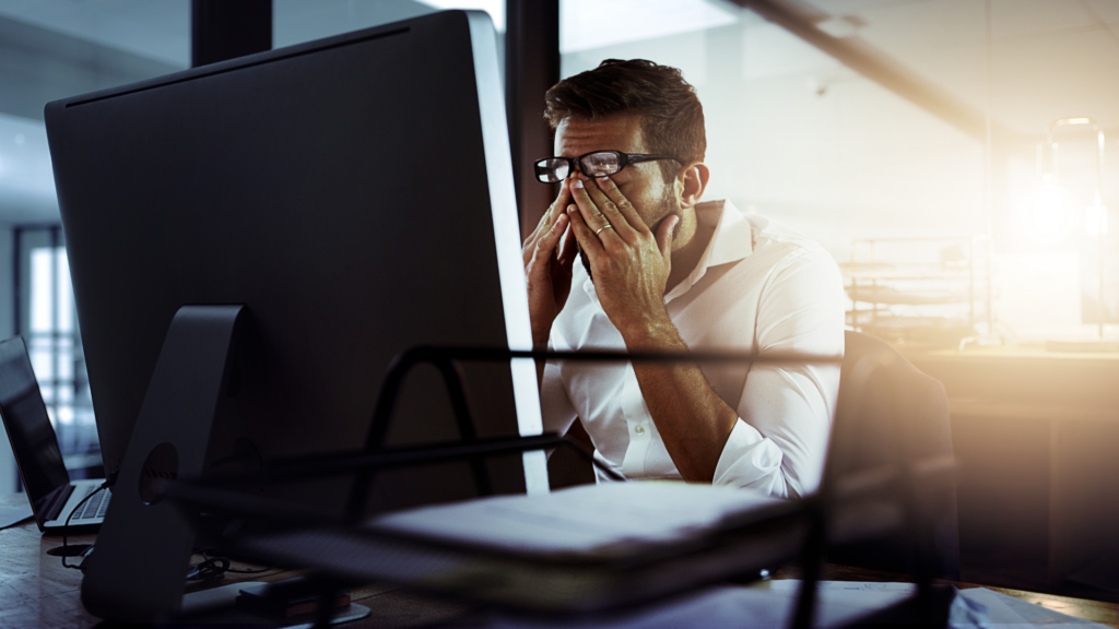 A frustrated man at his computer