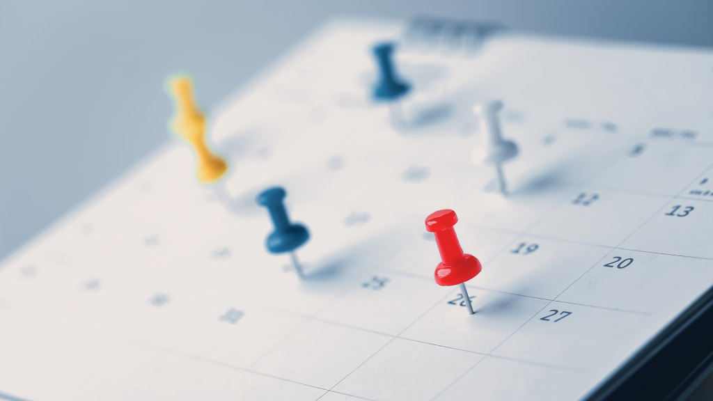 Calendar with pins in some of the dates