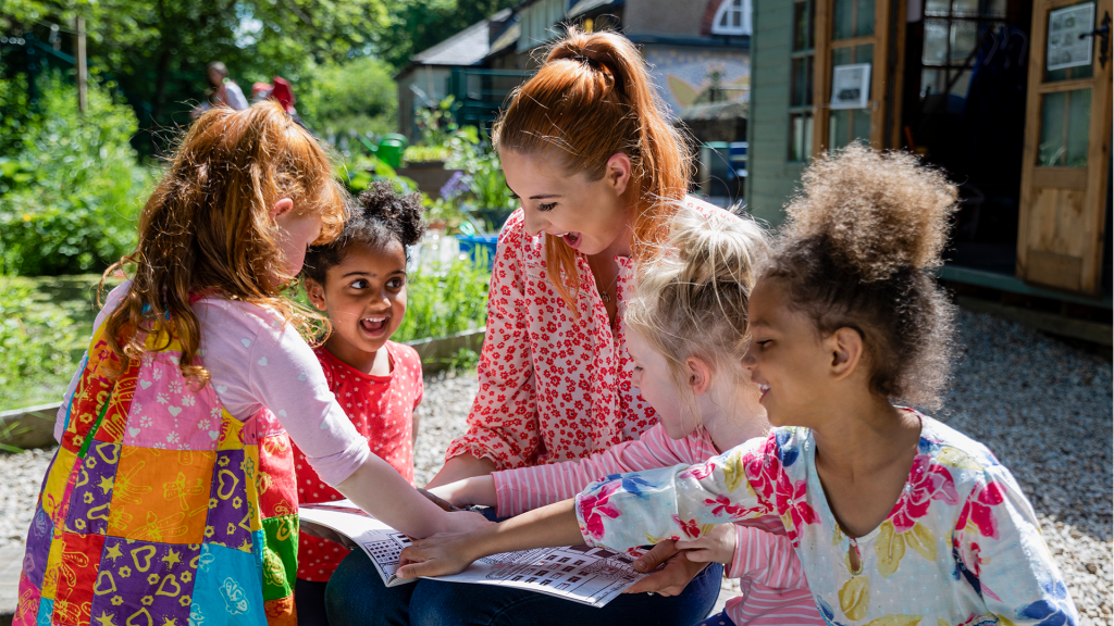 kids with teacher their teacher reading a book