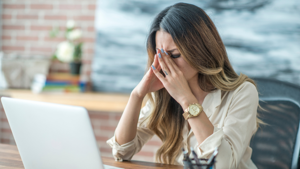 A woman stressed out at her computer