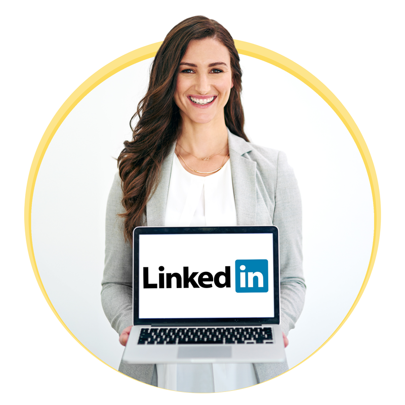 A woman holding a laptop with LinkedIn logo on it