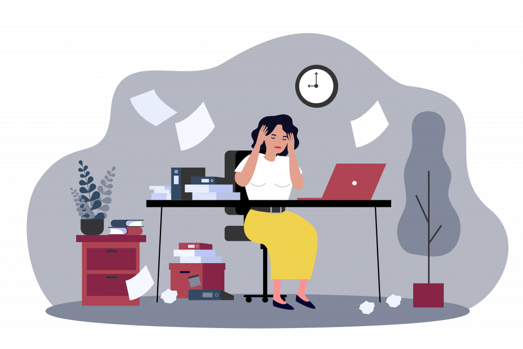 An illustration of an overwhelmed woman sitting at her work desk
